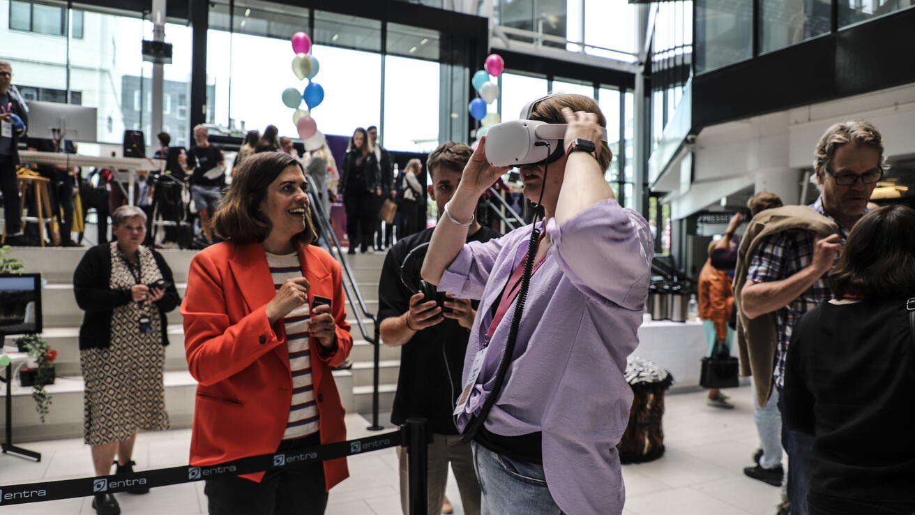 People testing VR in a crowd